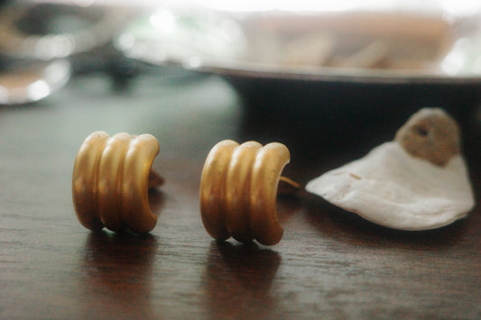 Vintage Monet Clip-On Earrings – Sculptural Gold Swirl Design