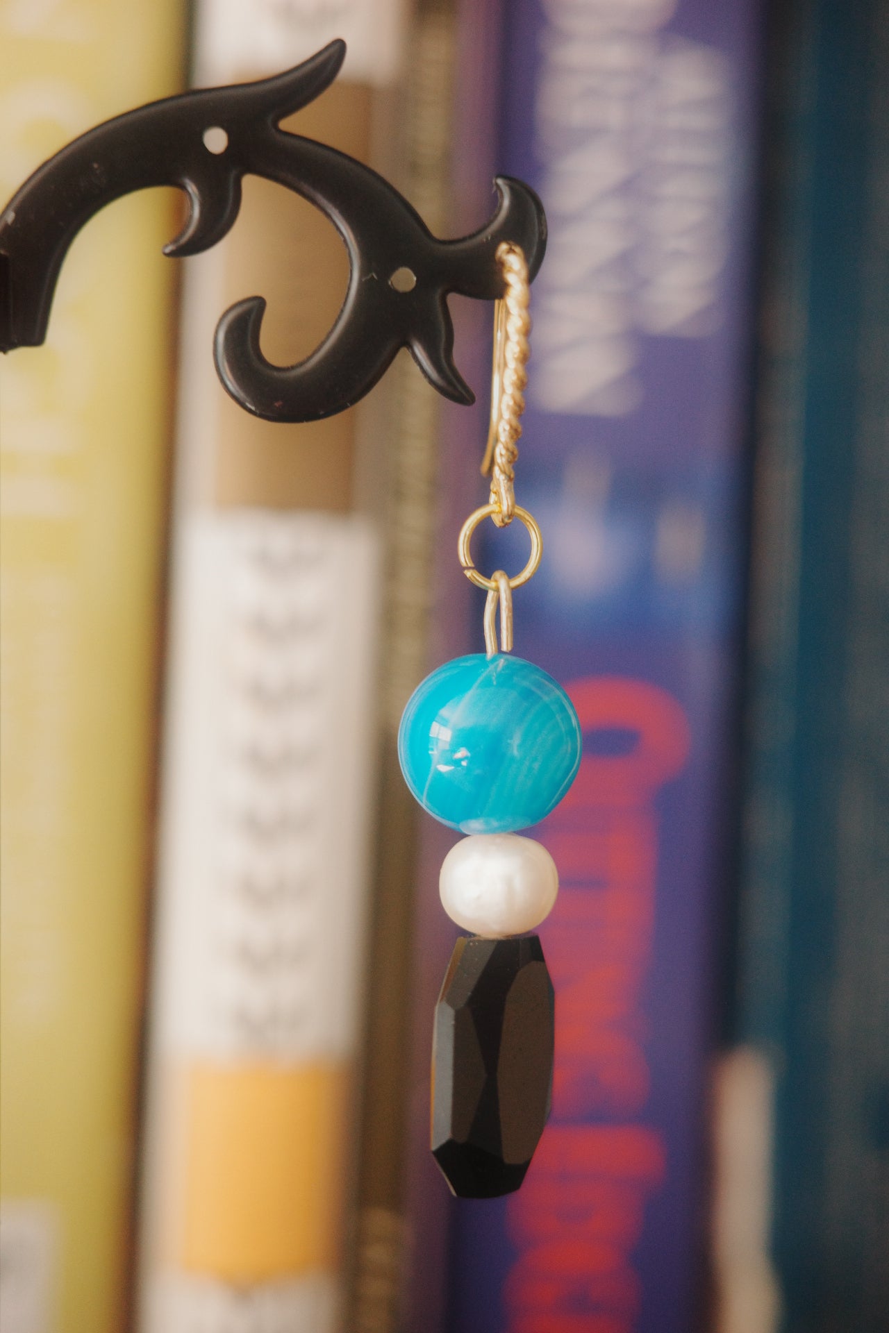 Close up of the handmade obsidian and pearl earrings