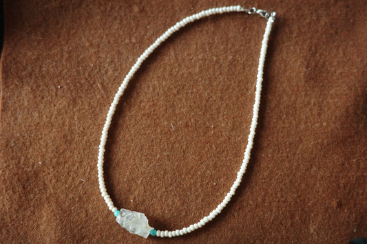 17-inch handmade necklace with a raw clear crystal centerpiece, Brazilian Amazonite beads, and small freshwater pearls on a sterling silver clasp