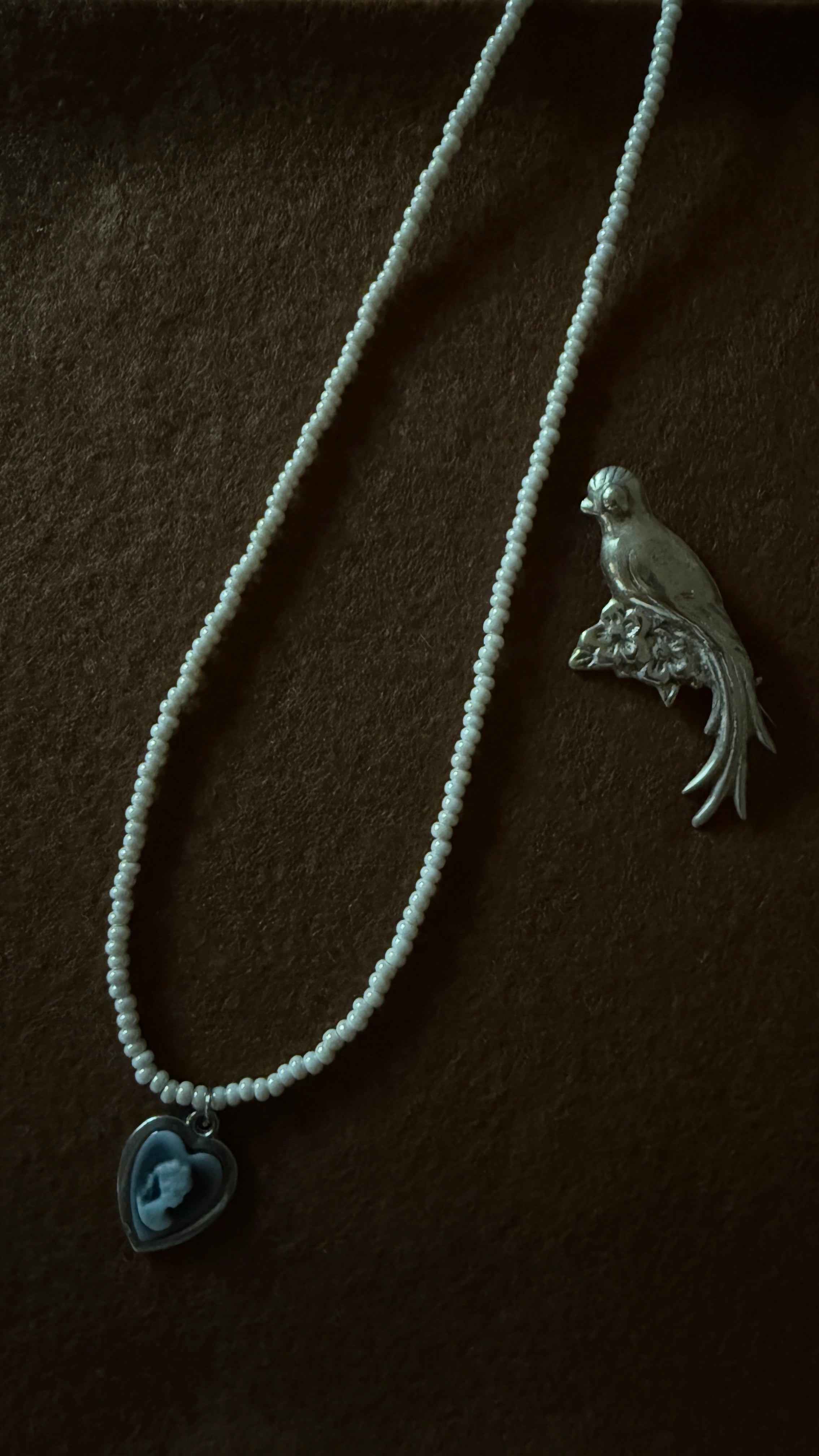 Portrait in Pearl Light – Glass Bead Necklace with Cameo Heart Pendant