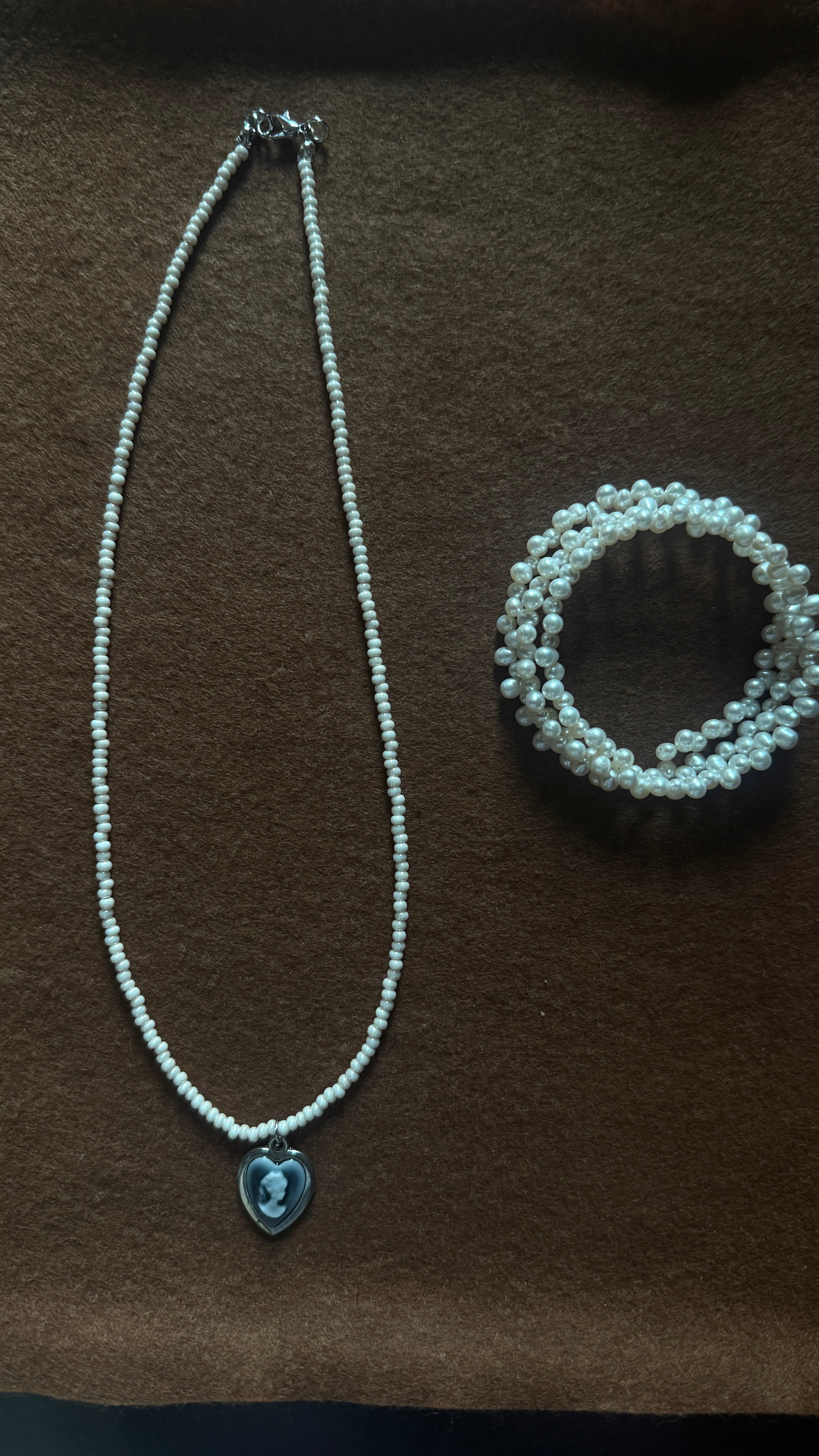 Portrait in Pearl Light – Glass Bead Necklace with Cameo Heart Pendant