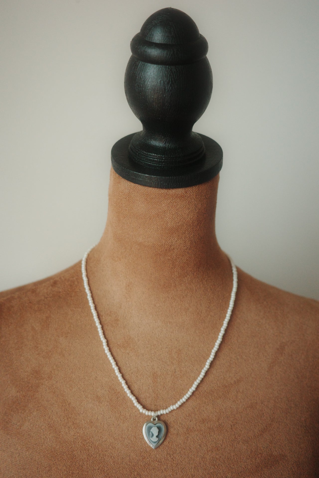 Portrait in Pearl Light – Glass Bead Necklace with Cameo Heart Pendant