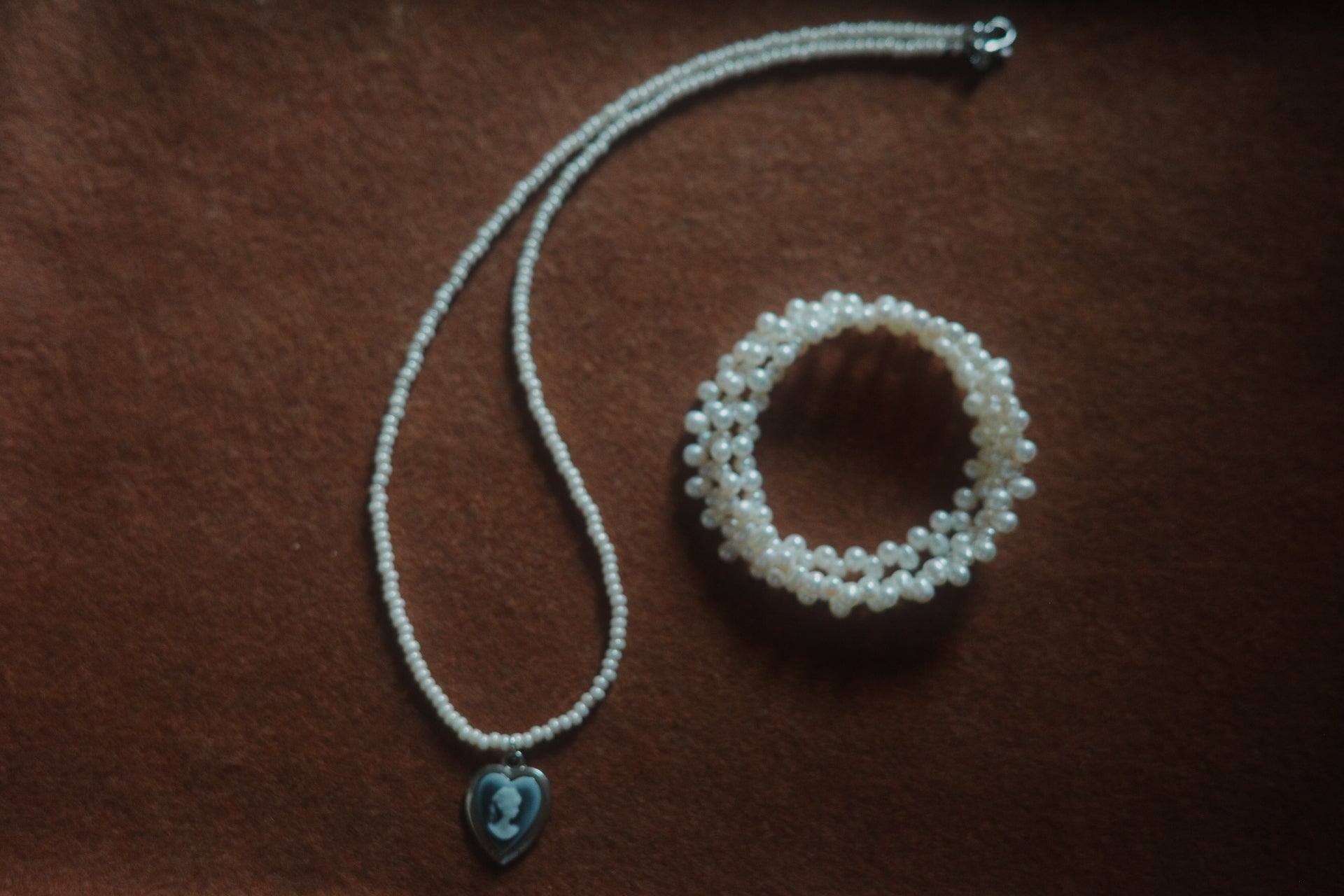 Portrait in Pearl Light – Glass Bead Necklace with Cameo Heart Pendant