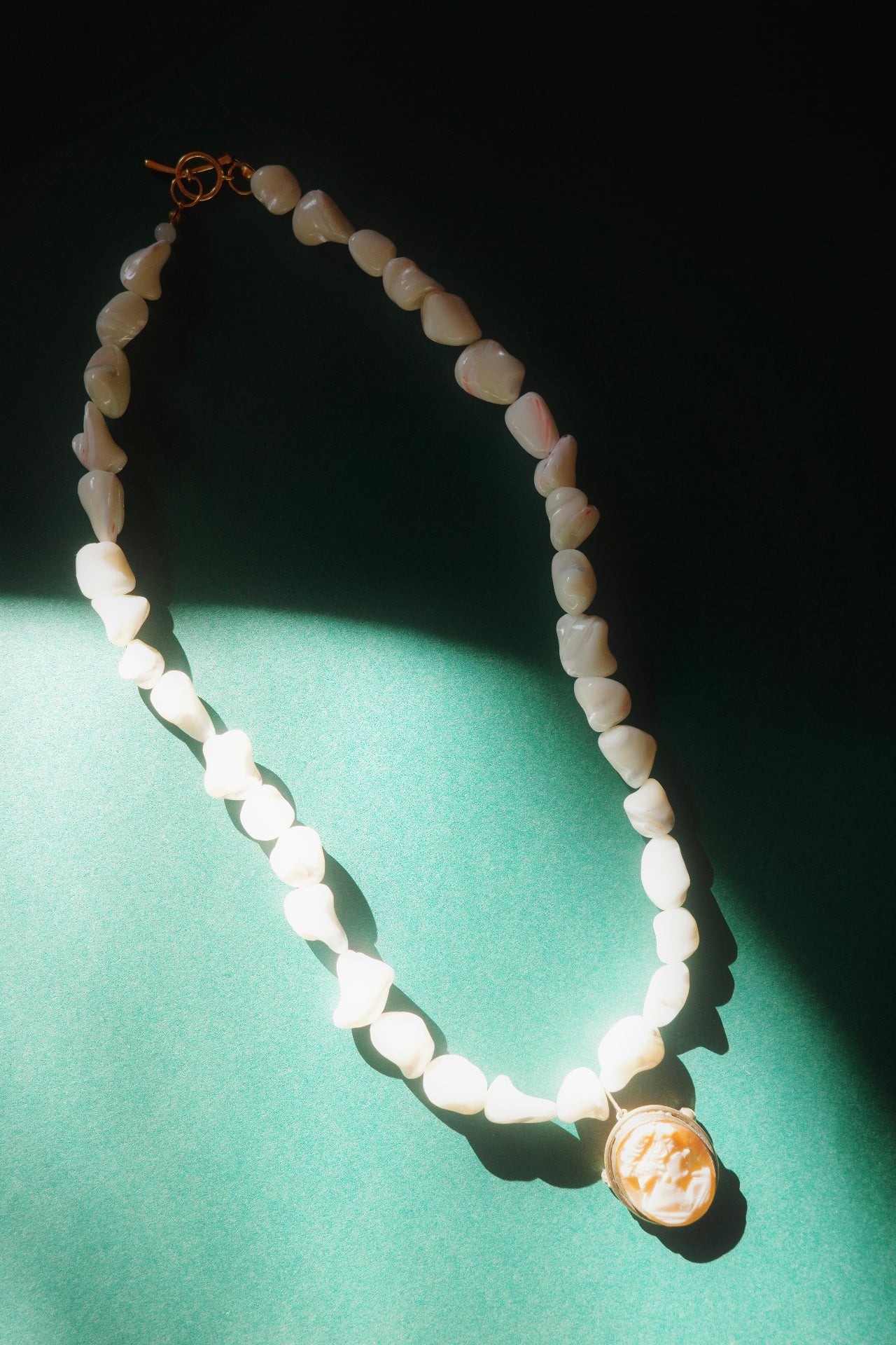 handmade necklace with pearl beads and vintage cameo pendant