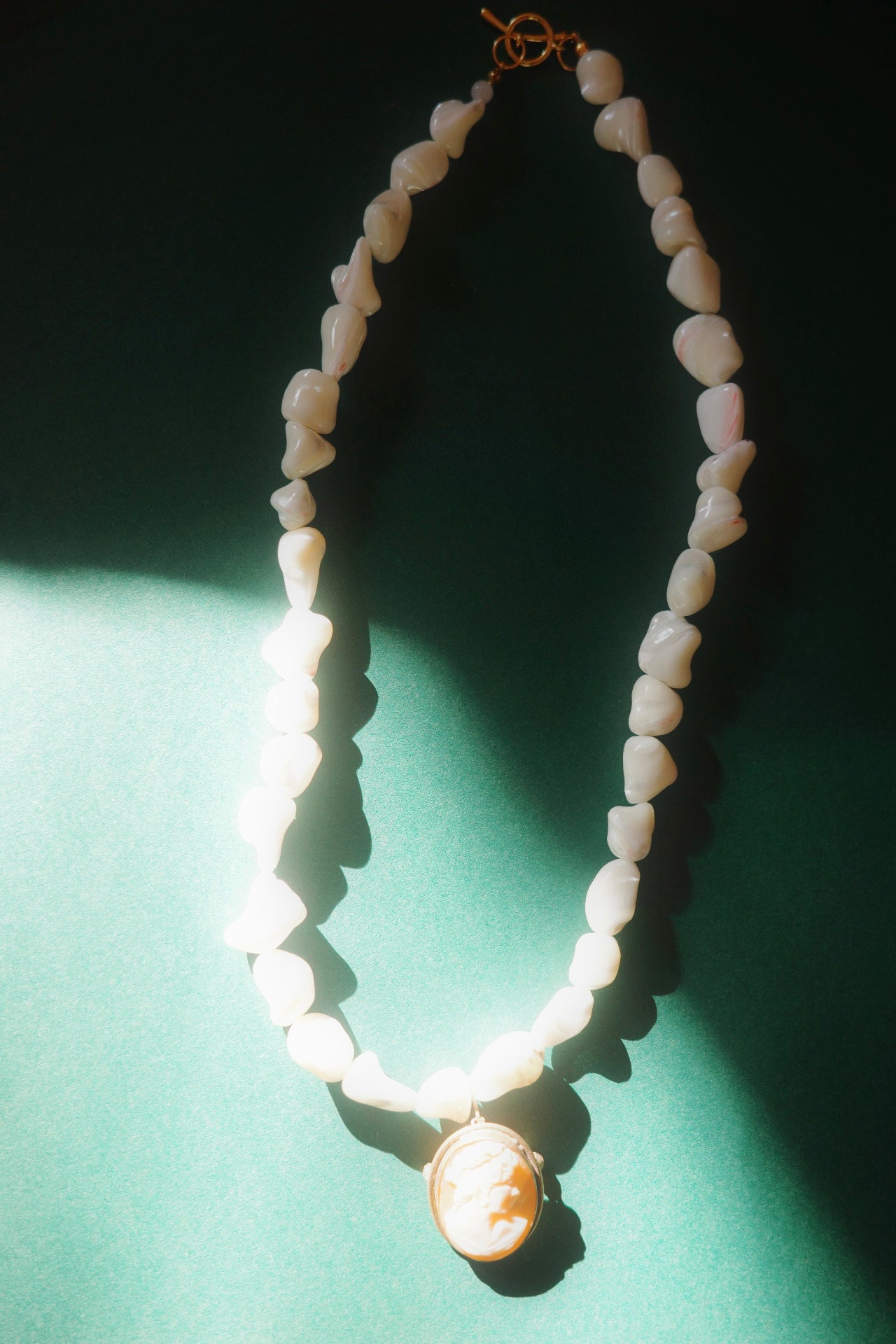 handmade necklace with pearl beads and vintage cameo pendant