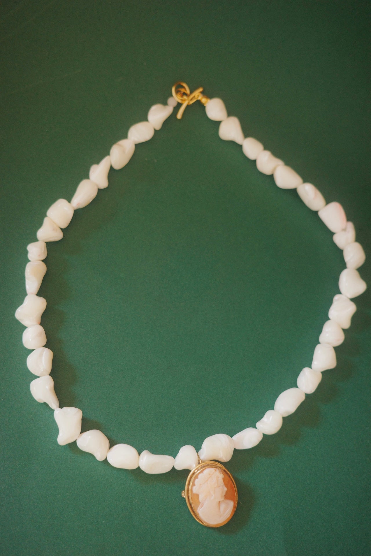 handmade necklace with pearl beads and vintage cameo pendant