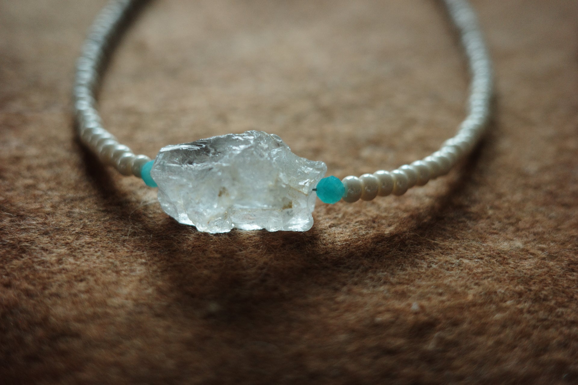 17-inch handmade necklace with a raw clear crystal centerpiece, Brazilian Amazonite beads, and small freshwater pearls on a sterling silver clasp