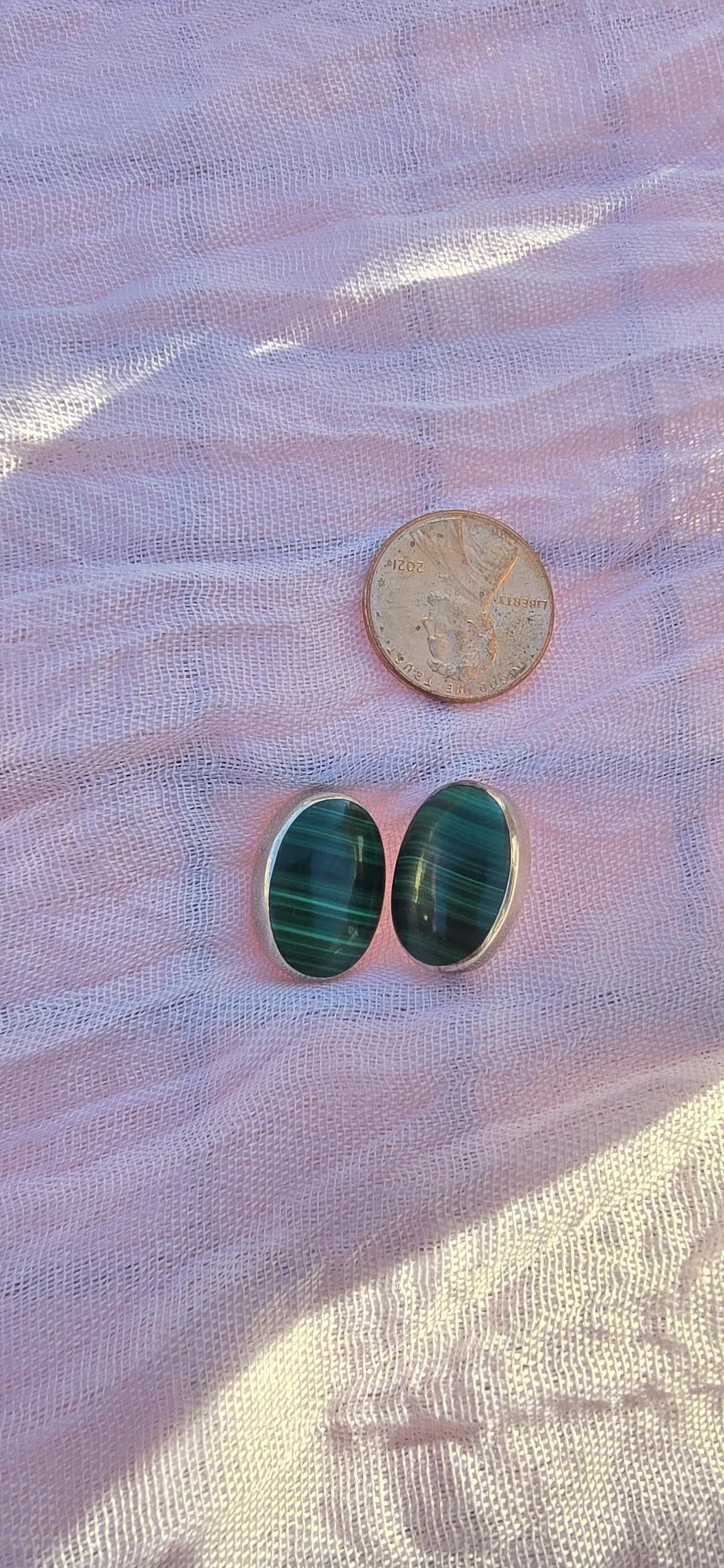 Close-up of green malachite stone set in 925 silver oval bezel, vintage Taxco jewelry